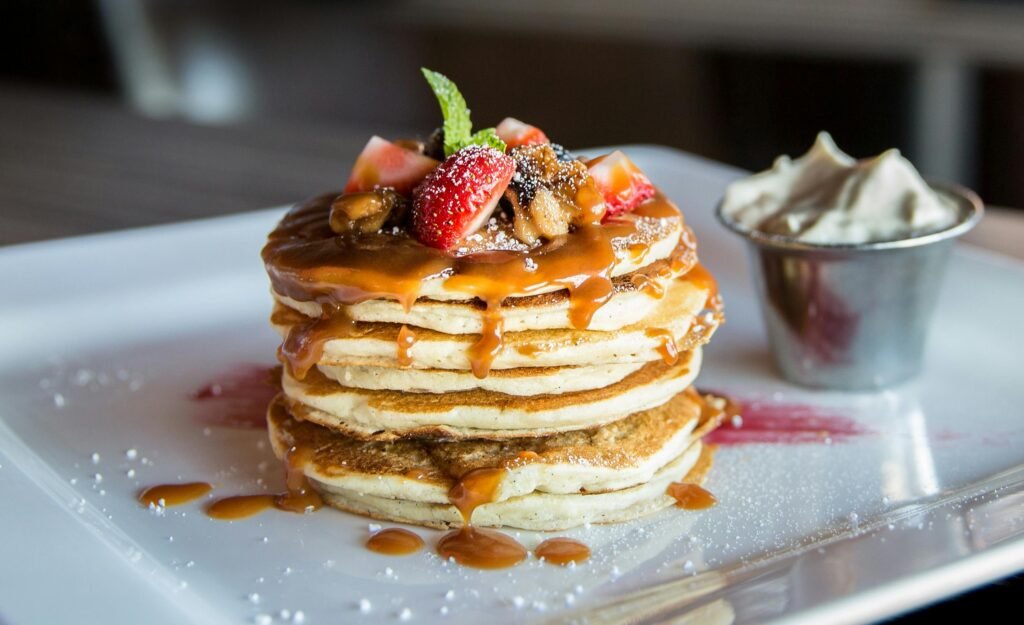 Pancakes stacked up on a plate: a great example of a budget breakfast from a local Airlie Beach cafe