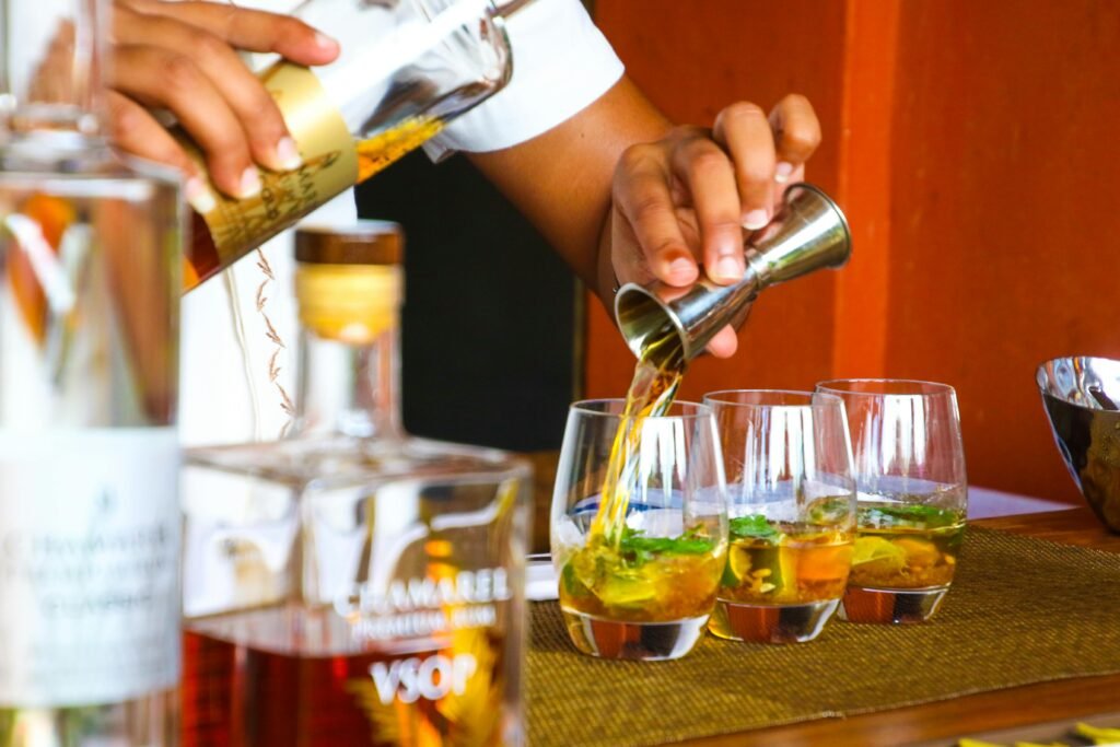 A bartender pouring drinks.