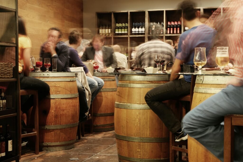 Tourists at a wine tasting; a great thing to try while traveling